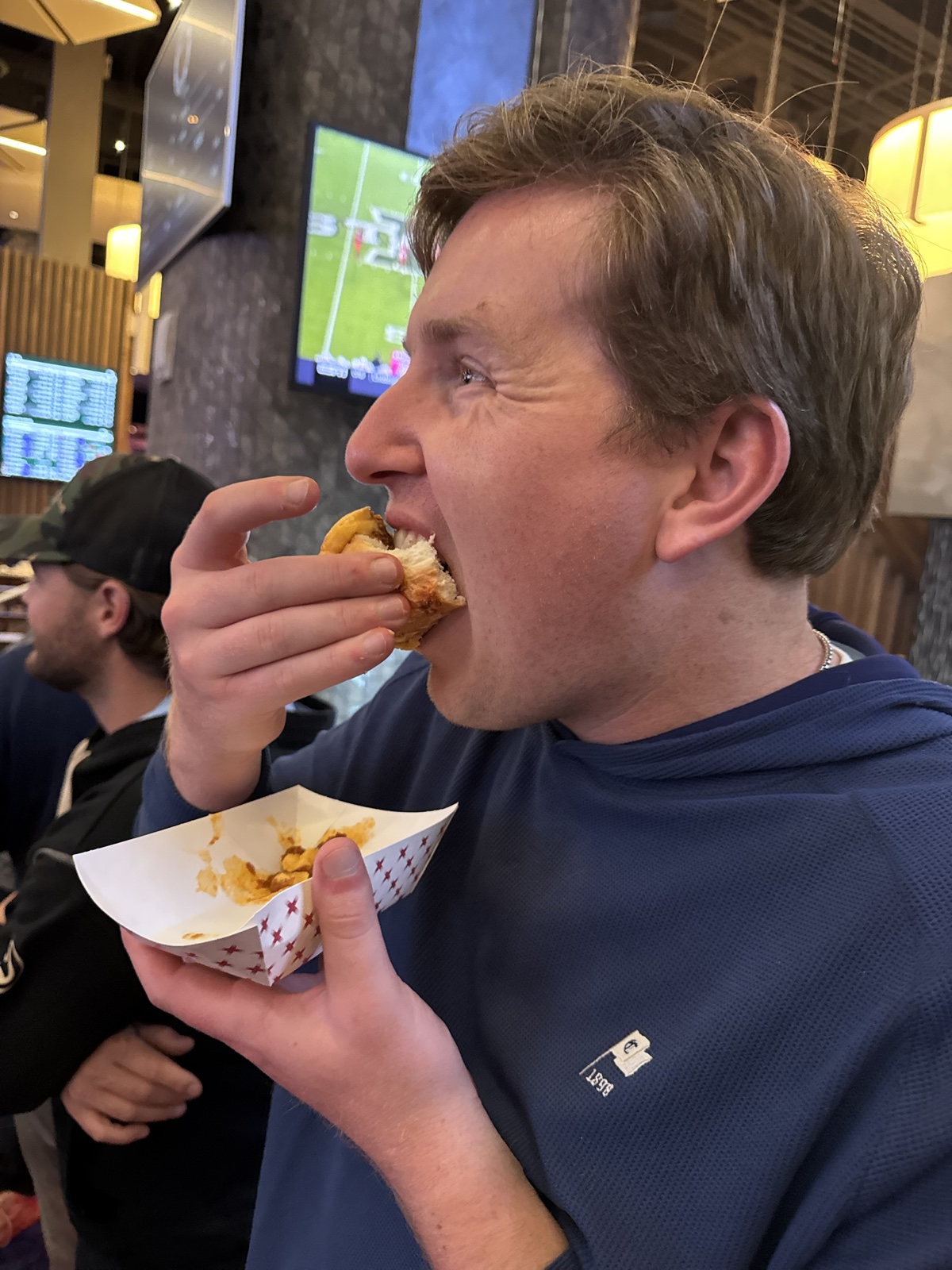 Tournament participant eating at the Cherokee sportsbook